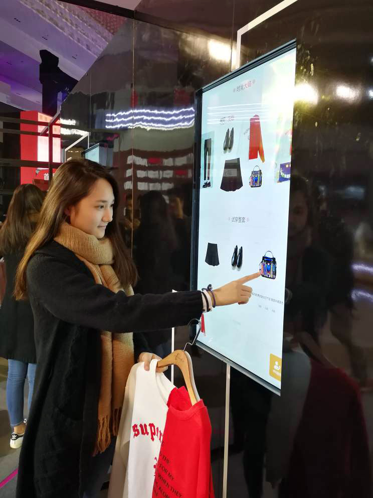 A shopper tries Alibaba's FashionAI system.